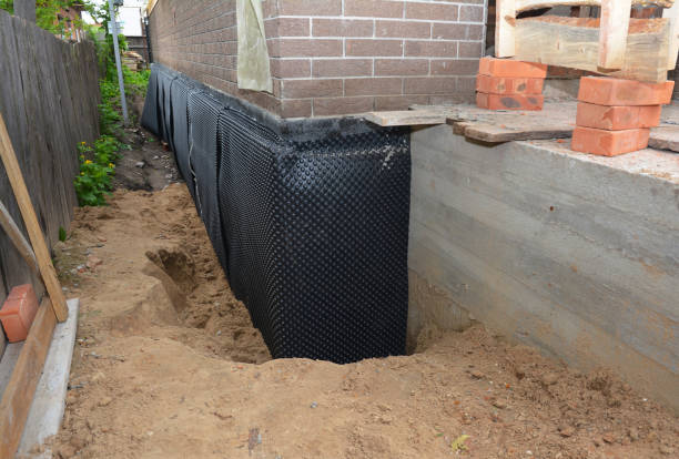 Happy homeowners after waterproofing job in Saint Johns